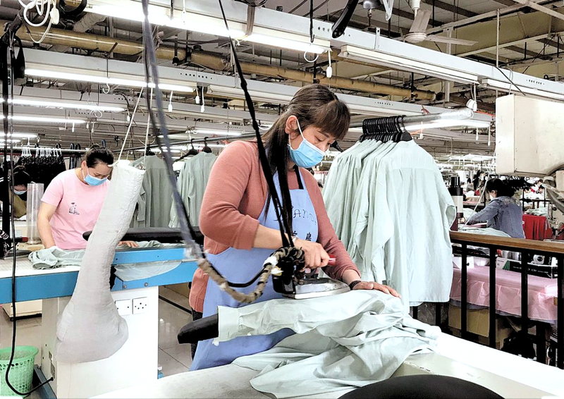Garment finishing and packing station ahead of shipment