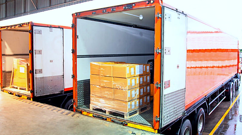 Packed hospitality uniform cartons loaded for shipment